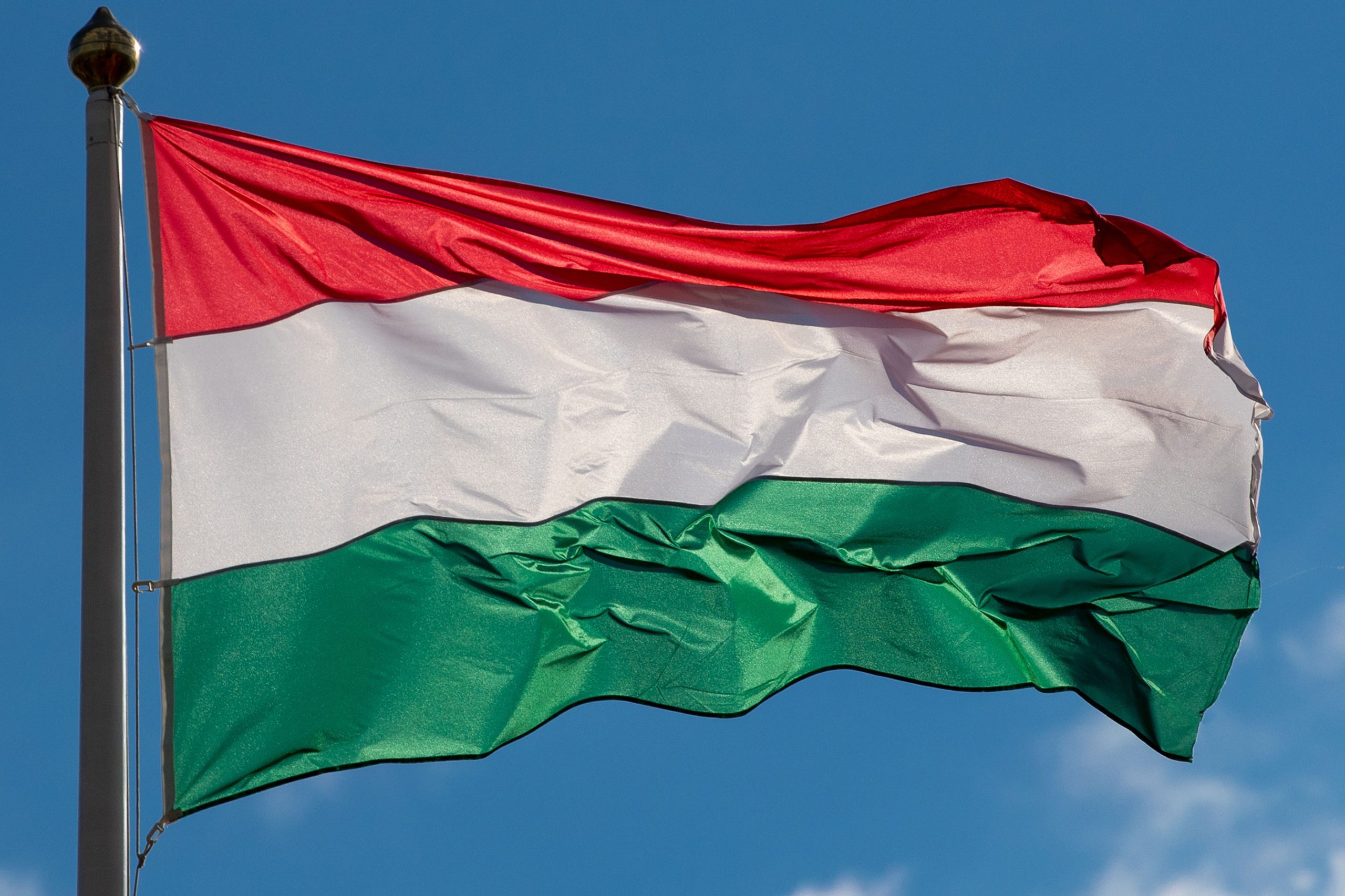 The Hungarian flag against the blue sky